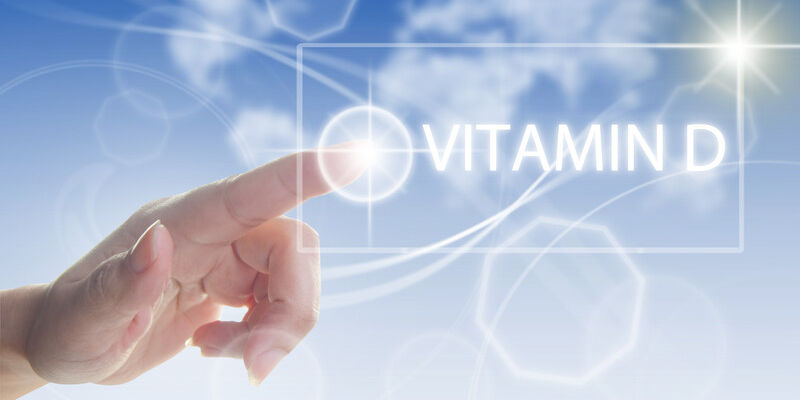 Finger pointing to words Vitamin D
