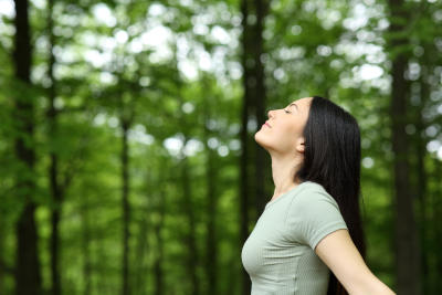 Woman feeling well in a forest